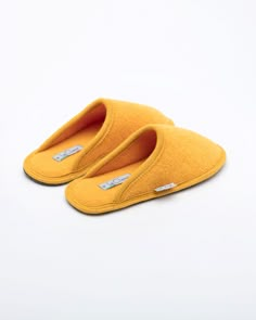 Description: The Le Clare women's Stella in yellow is the classic "hotel slipper" reimagined in luxurious yellow boiled wool. This quintessential slipper provides delicate comfort and has been handcrafted, only for the most discerning, the Stella will not disappoint. Featuring our premium Italian boiled wool fiber, the slipper gently conforms to your foot for cozy comfort. The natural elasticity of our wool bounces back to its original shape, giving the slipper lasting appeal with a customized f Comfortable Yellow Closed Toe Slippers, Comfortable Yellow Flat Slippers, Room Slippers, Comfortable Non-slip Yellow Slippers, Pigeon Nest, Yellow Slippers, Comfortable Wool Slip-on Slippers, Wool Indoor Slip-on Slippers, Classic Hotel