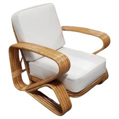 the chair is made out of wood and has white cushions