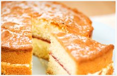 a close up of a cake on a plate with one slice taken out of it