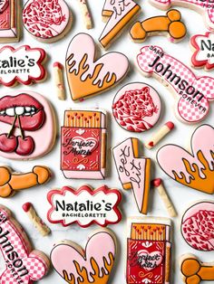 many decorated cookies are displayed on a white surface with the words natafie's