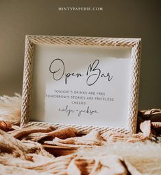 a coffee bar sign sitting on top of a bed