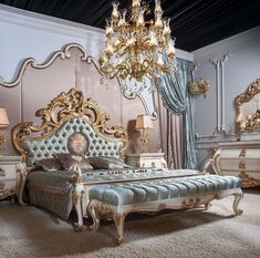 a fancy bedroom with an ornate bed and chandelier