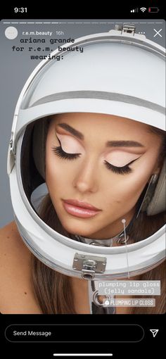 a woman with her eyes closed wearing a space suit