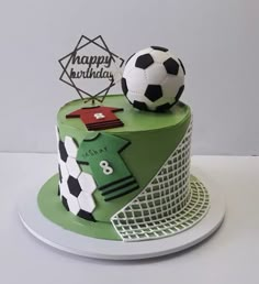 a soccer themed birthday cake on a plate