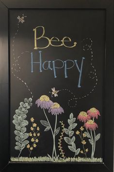 a chalkboard with bees and flowers painted on it that says bee happy in front of a black background