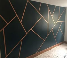 a room with a wall that has some lines painted on it and is being worked on