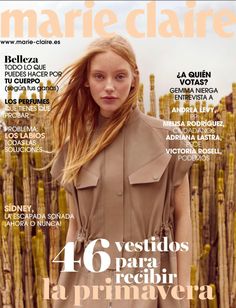 the cover of marie claire magazine, featuring a woman in a trench coat and dress