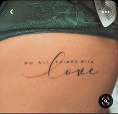 a woman's stomach with the words do all things with love written on it