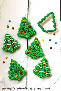 christmas rice krispie treats are arranged on a white surface with the words, christmas rice krispies treats