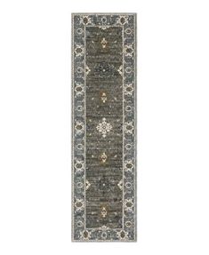 a gray and blue runner rug with an ornate design