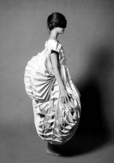 a woman in a dress made out of paper