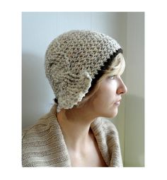 a woman is wearing a knitted hat