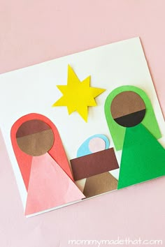 an origami nativity card with paper cutouts and stars on the top