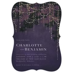 a purple and black wedding card with lights hanging from the branches on it's side