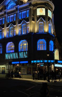 a large building with many windows lit up at night