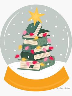 a snow globe filled with books and a star