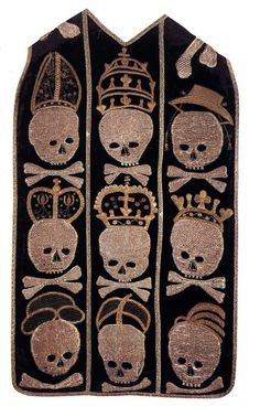 an embroidered piece with skulls and crowns on it