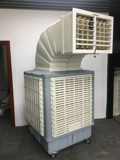 an air conditioner sitting on top of a cart