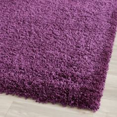 a purple rug on the floor in a room