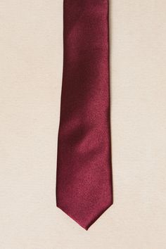 Say hello to our Mens Max Tie, now available in a luxurious wine satin fabric. Just in time for fall weddings. The self-tie style allows for a comfortable fit every time. Perfect for any occasion, this tie is sure to elevate your look. Burgundy Semi-formal Suit And Tie Accessories, Burgundy Standard Tie For Black Tie Events, Fitted Silk Tie For Wedding, Classic Satin Ties For Wedding, Classic Satin Standard Tie, Classic Adjustable Satin Ties, Elegant Standard Tie With Satin Finish, Wedding Satin Ties With Satin Finish, Elegant Satin Finish Tie