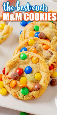 the best ever m & m cookies with m and m candies in them on a white plate