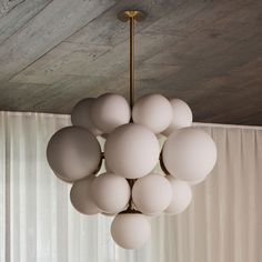 a chandelier hanging from the ceiling in a room