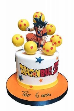 a birthday cake decorated with an image of gohan and yellow balls on the top