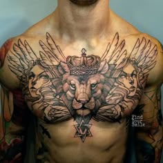 a man with tattoos on his chest has a lion and crown