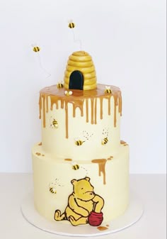 a winnie the pooh cake with honey dripping on it