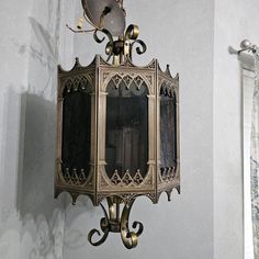 an ornate mirror mounted to the side of a wall