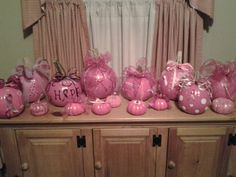 pink decorations are sitting on top of a dresser