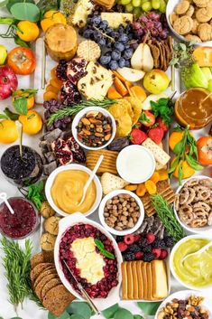 a platter with cheese, meats and fruit