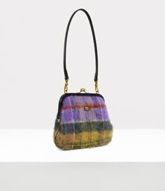 The Vivienne's clutch pays homage to the houses founder, showcasing our classic silhouette with a vintage-like kiss-lock frame. The piece features a tartan mohair fabric, capturing the essence of Scotland's rugged landscape of Scotland, created using a brushed effect technique. Fun Purses, Bag Vintage, Clasp Purse, Vintage Bag, Vivienne Westwood Tartan Bag, Mohair Fabric, Vintage Clutch, Antique Coins, The Vivienne