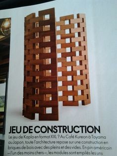 an article in a magazine about the construction of a building with wooden panels and lattices