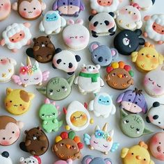 there are many different kinds of cookies on the table, all decorated in various colors and shapes