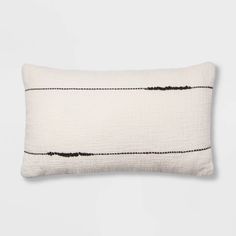 a white pillow with black lines on it