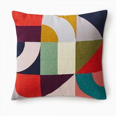 a multicolored pillow on a white background