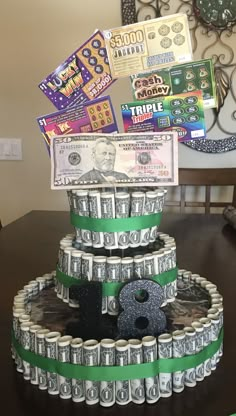 a cake made to look like money with the number thirteen on top and twenty dollar bills around it