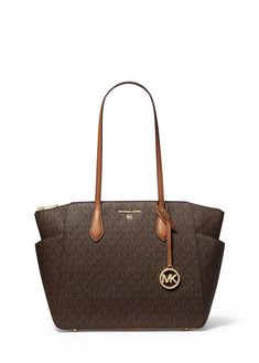 Long Description#Size & Fit#Meet your new favourite everyday bag. The Marilyn tote shows off our iconic MK initials along with a structured shape and spacious interior. Equipped with dedicated pockets for all your essentials this neat design makes on-the-go organisation a breeze. Slip the slimline leather straps over one shoulder on extra busy days. THIS PRODUCT CANNOT BE DELIVERED TO THE UK CHANNEL ISLANDS OR THE REPUBLIC OF IRELAND. Logo Tote Bag, Media Logo, Channel Islands, Republic Of Ireland, The Republic, Everyday Bag, Leather Straps, Initials, One Shoulder