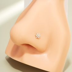 a close up view of a diamond ring on a mannequin's head