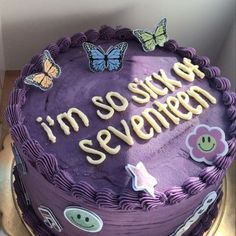 a birthday cake with purple frosting and butterflies on top that says, i'm so sixty seventy