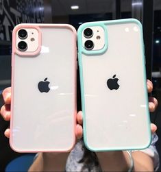 two people holding up their new iphones