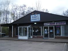 the front of a hair studio with its doors open