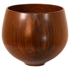 a wooden bowl is shown on a white background