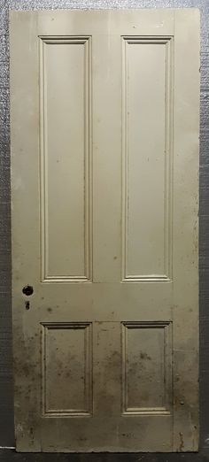 an old white door in a room