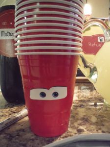 a stack of red cups sitting on top of a counter