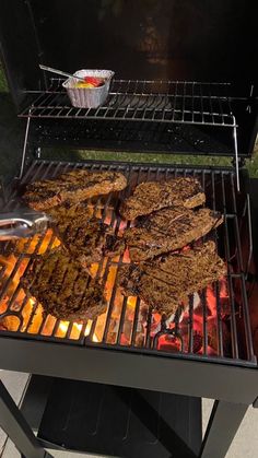 steaks cooking on an outdoor bbq grill