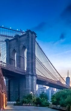 an image of the brooklyn bridge at dusk