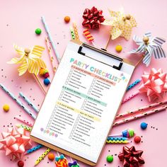 a party checklist on a clipboard surrounded by colorful pins and paper bows,