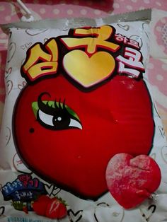 a heart shaped candy bag sitting on top of a table